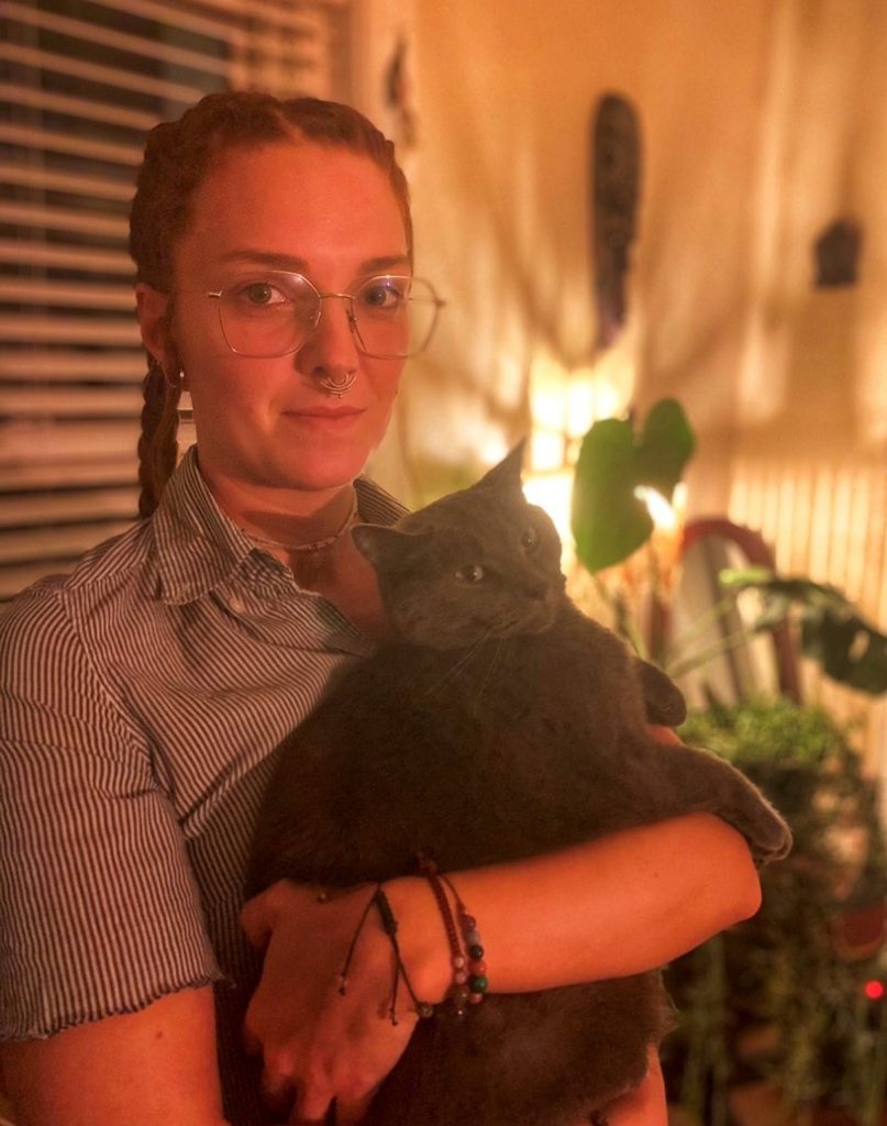 Molly holding her black cat